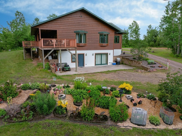 N5020 Red Pine Trl, Evergreen Twp, WI 54801 - back of house with a deck, a lawn, a patio, and stucco siding