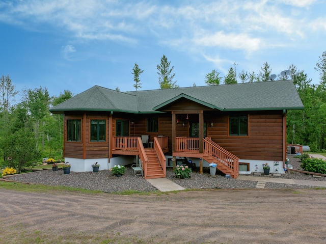 N5020 Red Pine Trl, Evergreen Twp, WI 54801 - view of front facade with stairs and roof with shingles