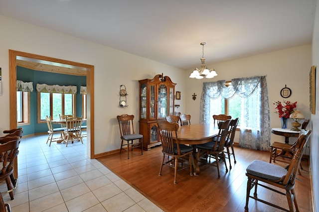 N5020 Red Pine Trl, Evergreen Twp, WI 54801 - dining room featuring healthy amount of natural light, a chandelier, and light wood-style flooring