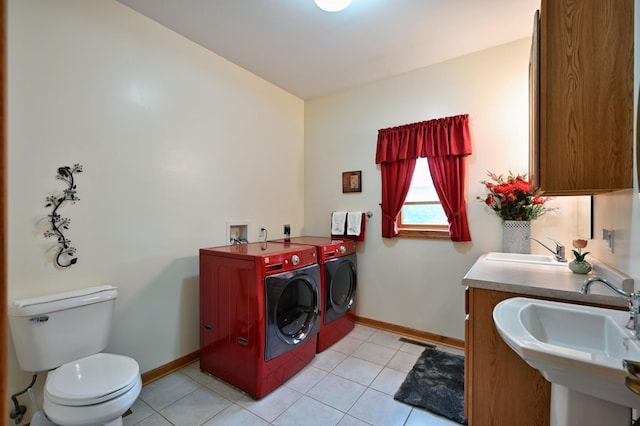 N5020 Red Pine Trl, Evergreen Twp, WI 54801 - laundry room with washing machine and clothes dryer and light tile patterned floors