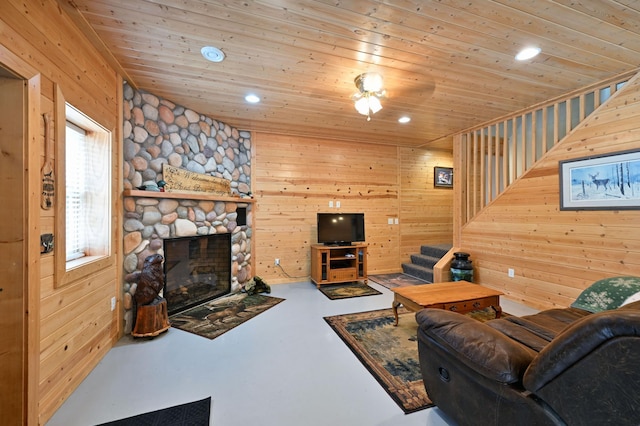 N5020 Red Pine Trl, Evergreen Twp, WI 54801 - living room featuring finished concrete flooring, stairway, wooden ceiling, wood walls, and recessed lighting