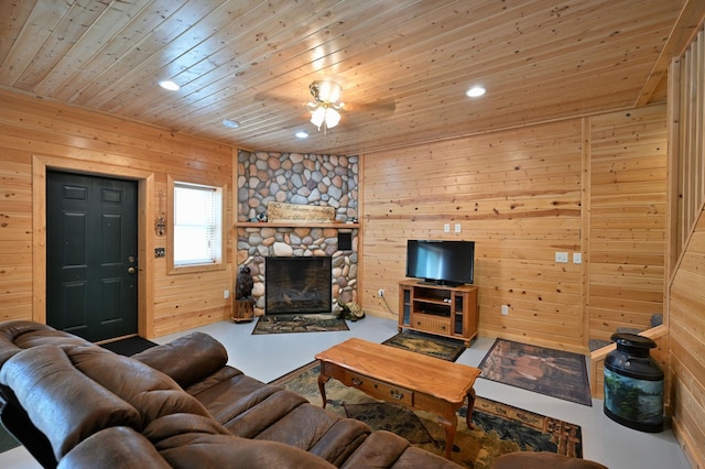 N5020 Red Pine Trl, Evergreen Twp, WI 54801 - living area with wooden walls, wood ceiling, and a fireplace