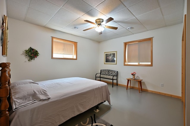 N5020 Red Pine Trl, Evergreen Twp, WI 54801 - bedroom with a paneled ceiling, finished concrete flooring, and a ceiling fan