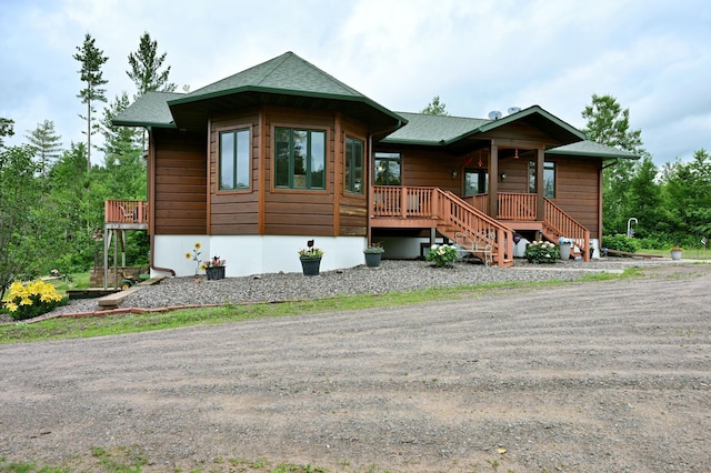 N5020 Red Pine Trl, Evergreen Twp, WI 54801 - view of front of house with covered porch and a shingled roof