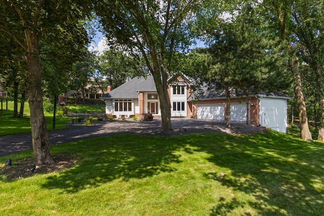11280 Bluestem Ln, Eden Prairie, MN 55347 - view of front of property featuring a front yard, driveway, and an attached garage