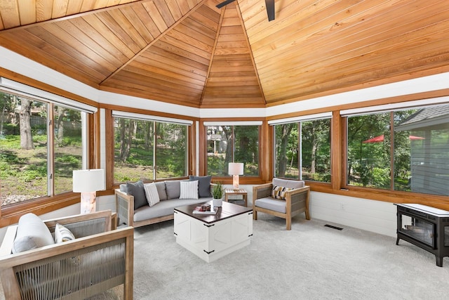 11280 Bluestem Ln, Eden Prairie, MN 55347 - sunroom featuring wood ceiling, vaulted ceiling, a wood stove, and carpet