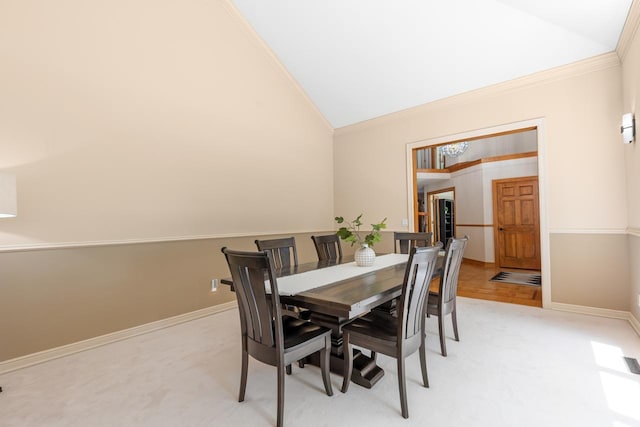 11280 Bluestem Ln, Eden Prairie, MN 55347 - dining room with vaulted ceiling, crown molding, and light carpet