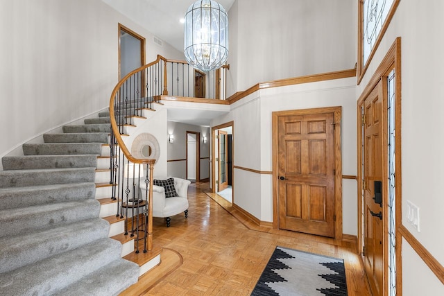 11280 Bluestem Ln, Eden Prairie, MN 55347 - foyer featuring stairs, a high ceiling, and a chandelier