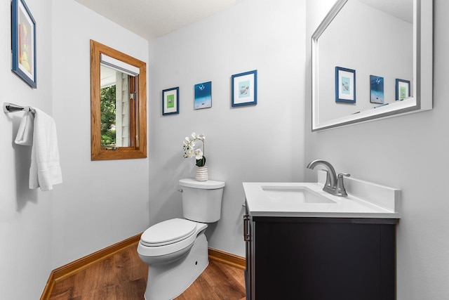 11280 Bluestem Ln, Eden Prairie, MN 55347 - half bathroom featuring wood finished floors and vanity