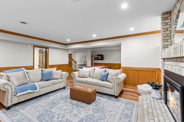 11280 Bluestem Ln, Eden Prairie, MN 55347 - living area with wainscoting, stairs, recessed lighting, wooden walls, and wood finished floors