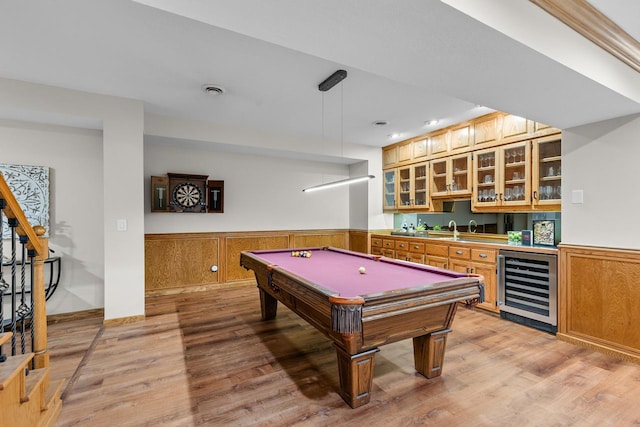 11280 Bluestem Ln, Eden Prairie, MN 55347 - recreation room featuring beverage cooler, wet bar, a wainscoted wall, light wood-type flooring, and billiards
