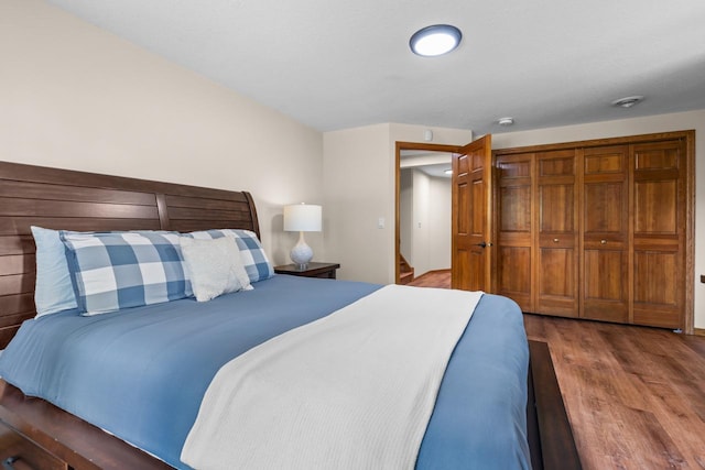 11280 Bluestem Ln, Eden Prairie, MN 55347 - bedroom featuring wood finished floors and a closet