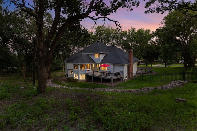 11280 Bluestem Ln, Eden Prairie, MN 55347 - back of house with a deck, a fenced backyard, and a chimney