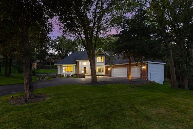11280 Bluestem Ln, Eden Prairie, MN 55347 - view of front facade with driveway and a lawn