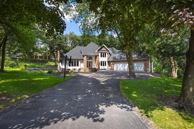 11280 Bluestem Ln, Eden Prairie, MN 55347 - view of front of home with asphalt driveway and a garage