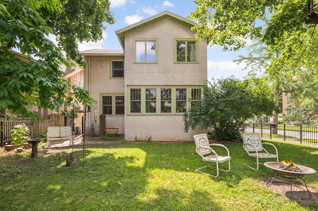 901 42nd St, Minneapolis, MN 55409 - back of property with a fire pit and stucco siding