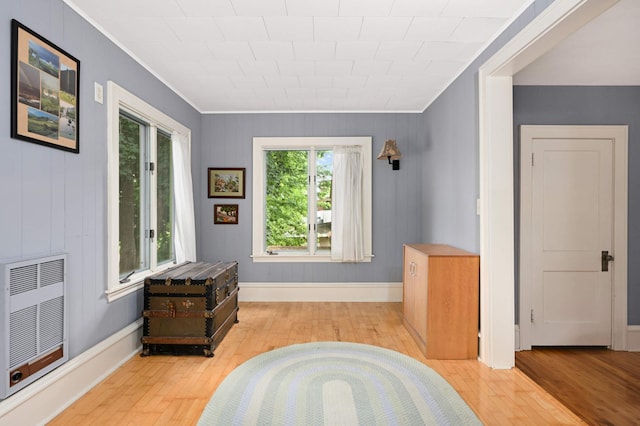 901 42nd St, Minneapolis, MN 55409 - sitting room featuring crown molding, heating unit, and wood finished floors
