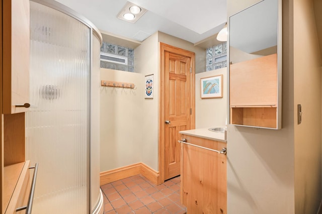 901 42nd St, Minneapolis, MN 55409 - bathroom featuring a shower stall, vanity, and tile patterned flooring