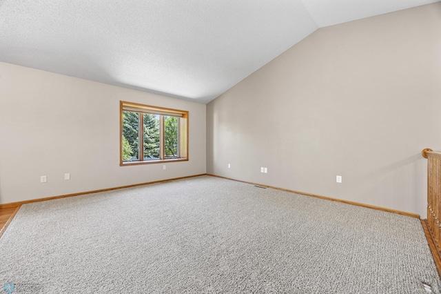 2812 Wheatland Dr S, Fargo, ND 58103 - empty room with lofted ceiling and light carpet