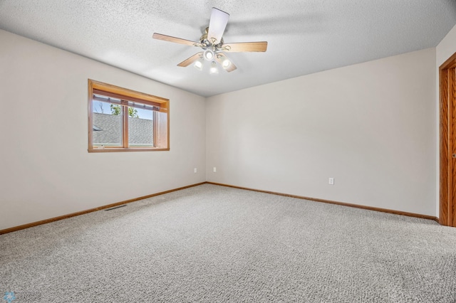 2812 Wheatland Dr S, Fargo, ND 58103 - carpeted spare room featuring ceiling fan and a textured ceiling
