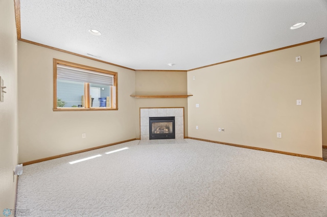 2812 Wheatland Dr S, Fargo, ND 58103 - unfurnished living room featuring ornamental molding, a fireplace, carpet, a textured ceiling, and recessed lighting