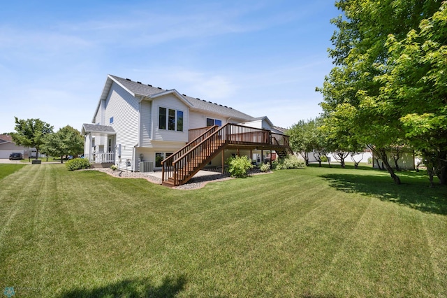 2812 Wheatland Dr S, Fargo, ND 58103 - rear view of property with stairway, a wooden deck, and a lawn