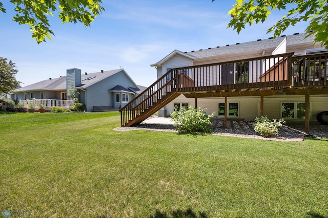 2812 Wheatland Dr S, Fargo, ND 58103 - back of house featuring a wooden deck, a lawn, and stairway