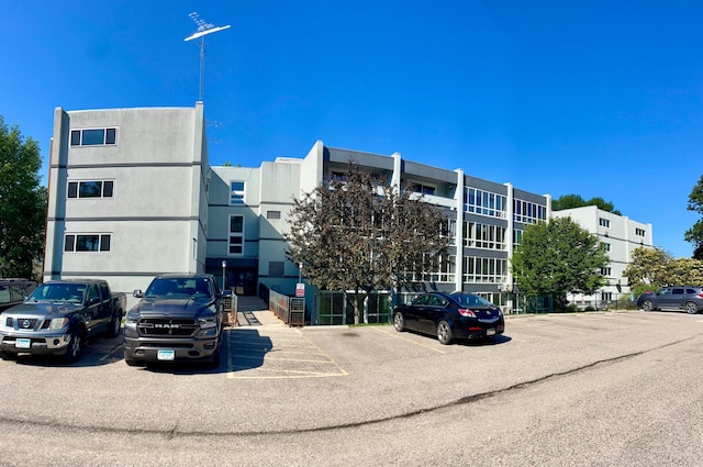 315 Park Lake Blvd Unit 104, Detroit Lakes, MN 56501 - view of building exterior with uncovered parking