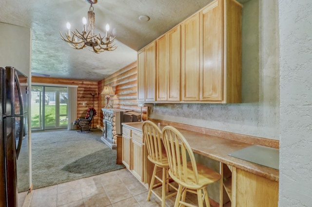 315 Park Lake Blvd Unit 104, Detroit Lakes, MN 56501 - kitchen featuring log walls, a chandelier, light brown cabinetry, light colored carpet, and light tile patterned floors