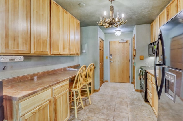 315 Park Lake Blvd Unit 104, Detroit Lakes, MN 56501 - kitchen with black appliances, a chandelier, light brown cabinets, light tile patterned floors, and decorative light fixtures