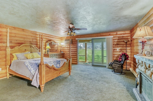 315 Park Lake Blvd Unit 104, Detroit Lakes, MN 56501 - carpeted bedroom with access to exterior, a fireplace, log walls, and ceiling fan