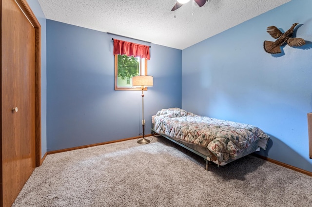 39123 Kc Dr, Homer Twp, MN 55987 - bedroom with carpet flooring, a closet, a textured ceiling, and a ceiling fan