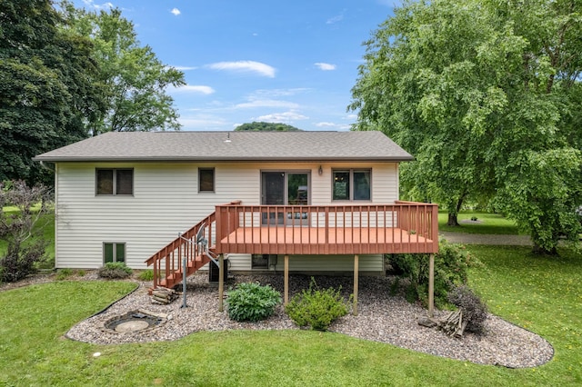 39123 Kc Dr, Homer Twp, MN 55987 - rear view of house with a yard, a wooden deck, stairway, and a shingled roof