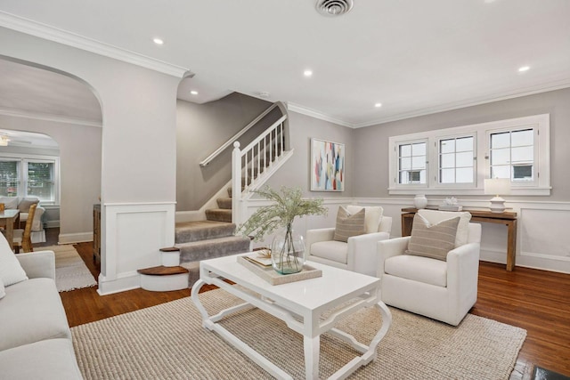 4510 Arden Ave, Edina, MN 55424 - living area with plenty of natural light, wood finished floors, a wainscoted wall, stairs, and arched walkways
