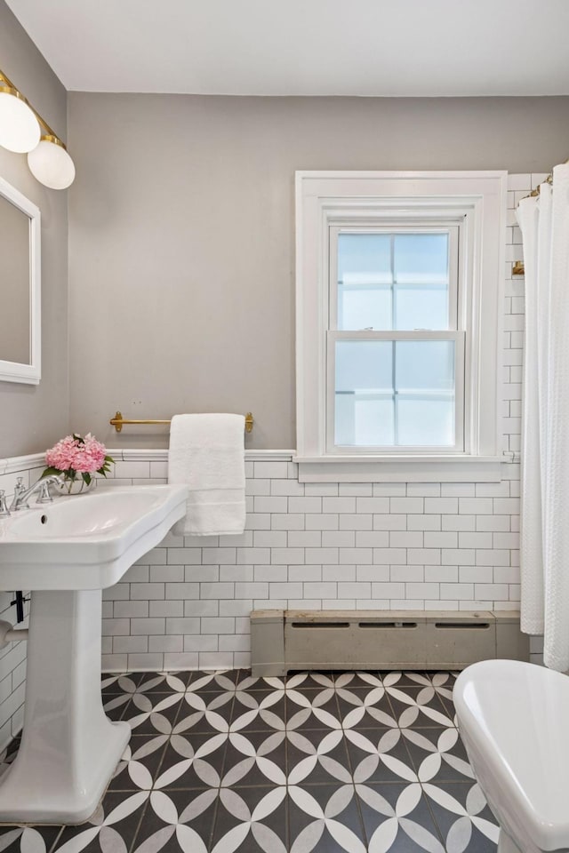 4510 Arden Ave, Edina, MN 55424 - bathroom with tile walls, wainscoting, and tile patterned floors