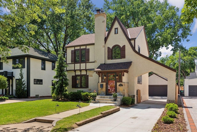 4510 Arden Ave, Edina, MN 55424 - view of front of property featuring stucco siding, a chimney, a shingled roof, and a garage