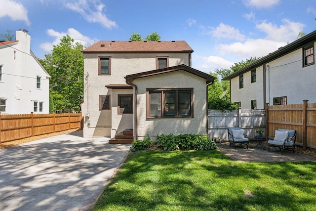 4510 Arden Ave, Edina, MN 55424 - view of front facade featuring stucco siding, a patio area, and a fenced backyard