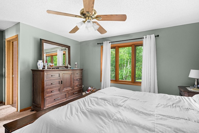 9614 Hayes Rd, Mountain Iron, MN 55768 - bedroom with multiple windows, a textured ceiling, and a ceiling fan