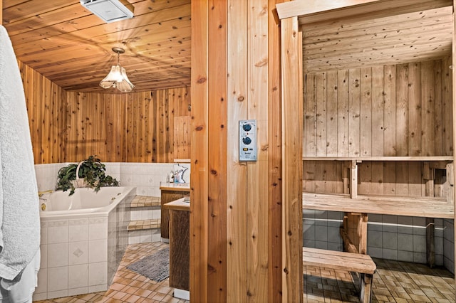 9614 Hayes Rd, Mountain Iron, MN 55768 - relaxing sauna / steam room featuring wooden walls, wood ceiling, and tile patterned floors