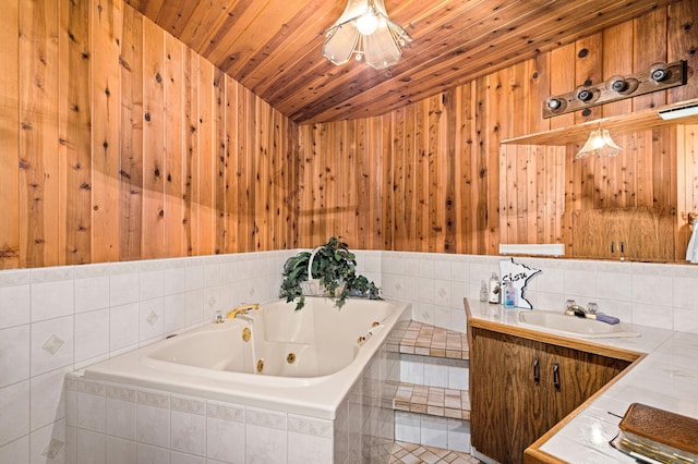 9614 Hayes Rd, Mountain Iron, MN 55768 - bathroom with a tub with jets, vanity, wood ceiling, and wooden walls