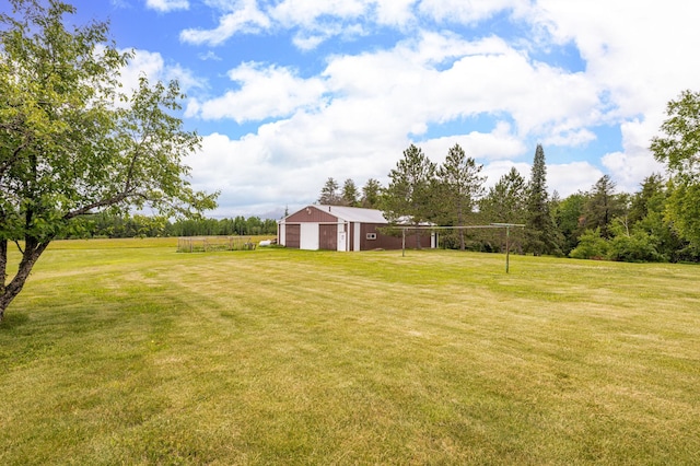 9614 Hayes Rd, Mountain Iron, MN 55768 - view of green lawn with a garage and an outbuilding