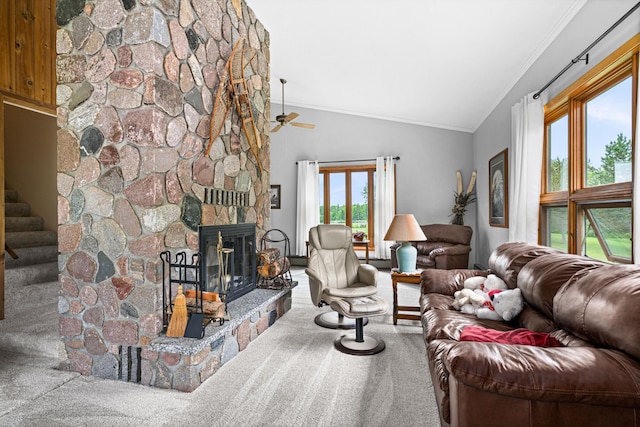 9614 Hayes Rd, Mountain Iron, MN 55768 - carpeted living area featuring ornamental molding, vaulted ceiling, stairs, ceiling fan, and a stone fireplace