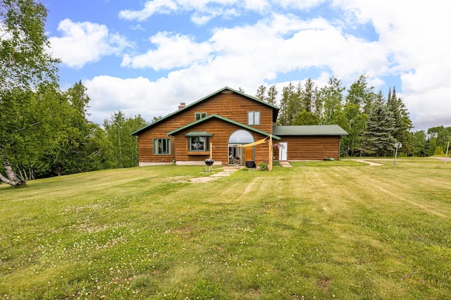 9614 Hayes Rd, Mountain Iron, MN 55768 - back of house featuring a lawn and view of scattered trees
