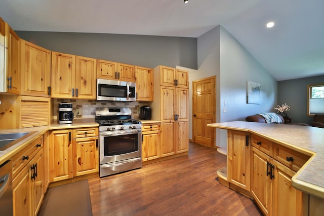 30467 Lakeview Dr, Breezy Point, MN 56472 - kitchen with appliances with stainless steel finishes, high vaulted ceiling, backsplash, open floor plan, and light countertops