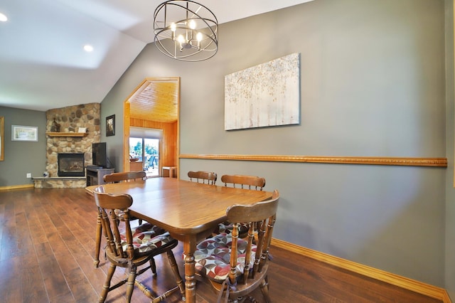 30467 Lakeview Dr, Breezy Point, MN 56472 - dining room with vaulted ceiling, wood finished floors, a stone fireplace, and a chandelier