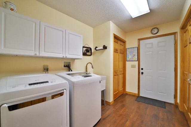 30467 Lakeview Dr, Breezy Point, MN 56472 - laundry room with cabinet space, washer and clothes dryer, dark wood-style floors, and a textured ceiling