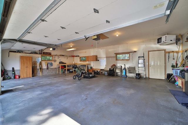 30467 Lakeview Dr, Breezy Point, MN 56472 - garage featuring a garage door opener, a workshop area, and a heating unit