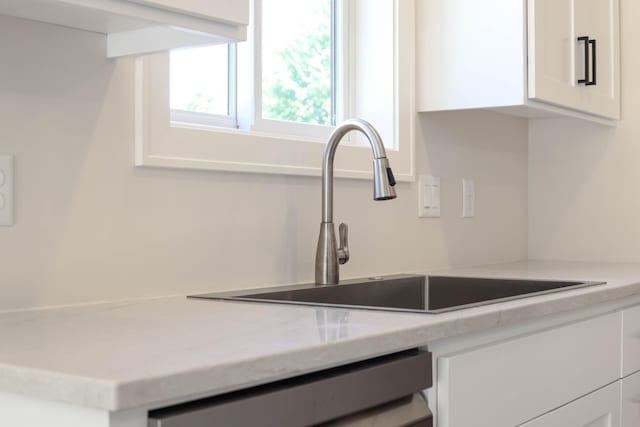 2529 Elmcroft Dr SW, Rochester, MN 55902 - kitchen view of white cabinets, light countertops, and dishwasher