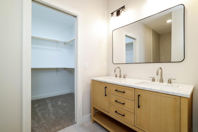 2529 Elmcroft Dr SW, Rochester, MN 55902 - bathroom with double vanity and a spacious closet