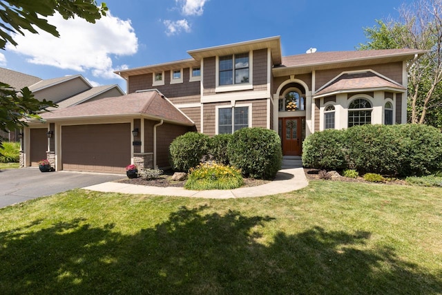 12346 Harvard Ave, Eden Prairie, MN 55347 - view of front of property featuring an attached garage, a front yard, and asphalt driveway